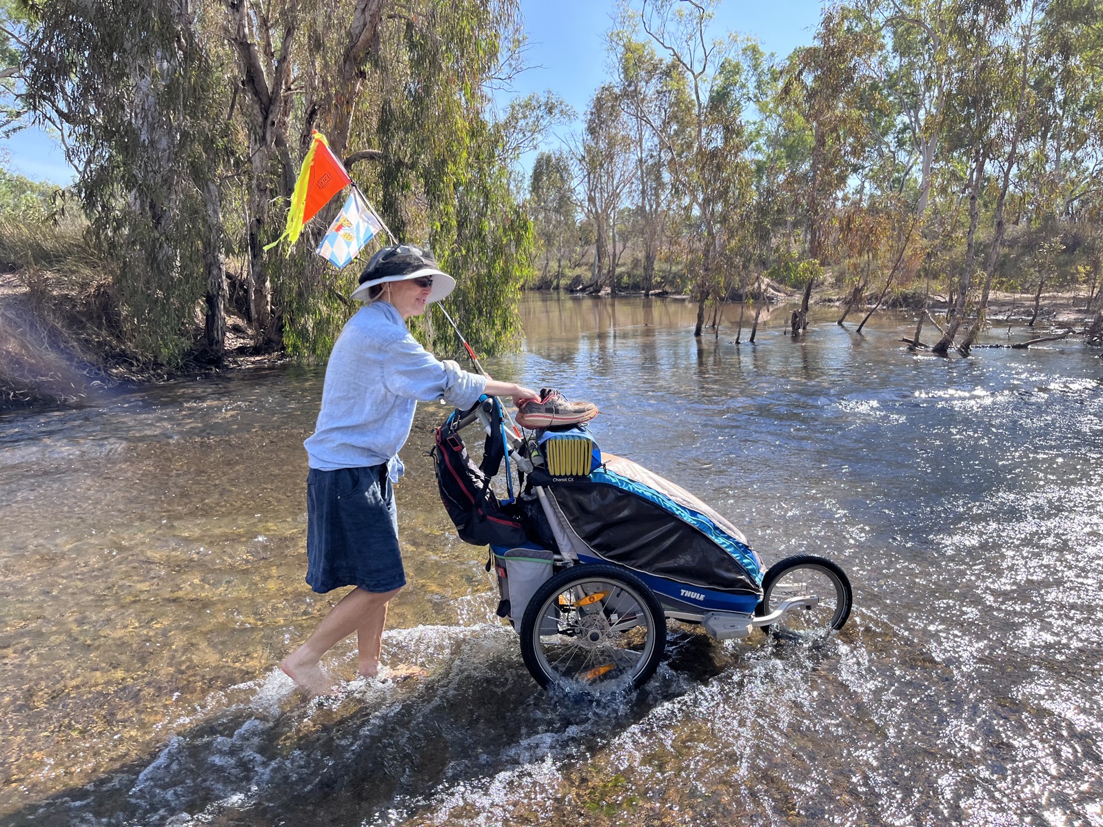 Barefoot river crossing, boots on the pram